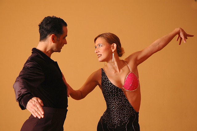 A couple of dancers dancing salsa